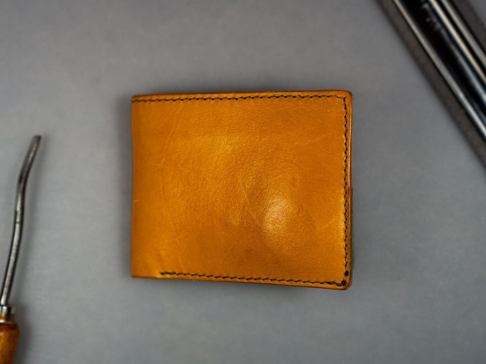 Tan leather bifold wallet, closed