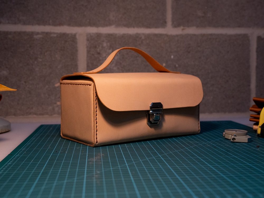 Natural leather tool case with a handle and clasp